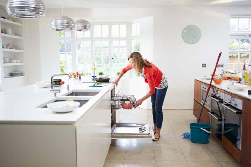 woman loading the dishwasher