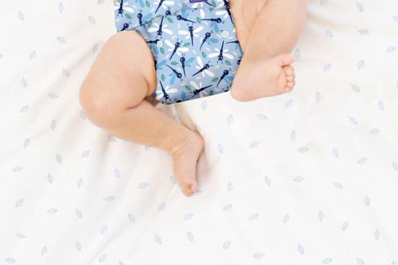Baby in blue organic diapers