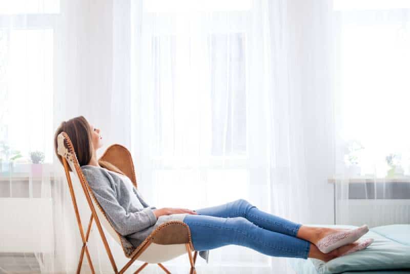 woman sitting and relaxing in a chair