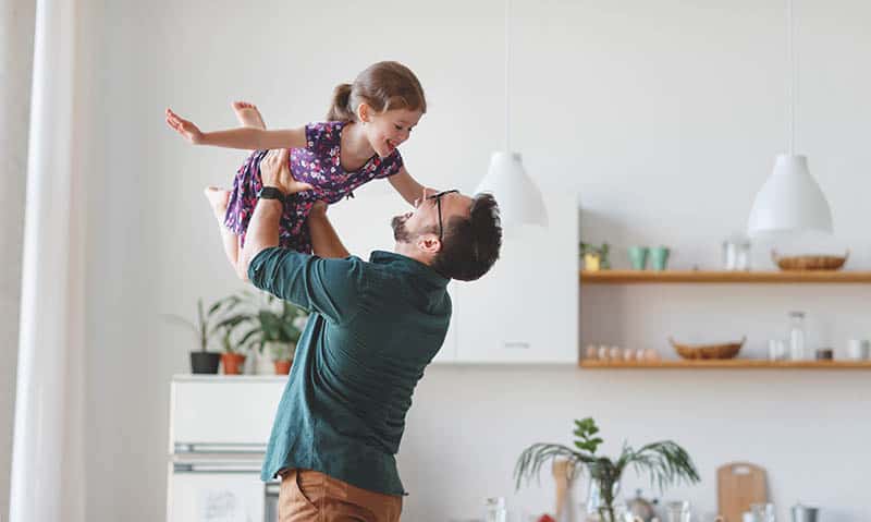 father playing with his daughter