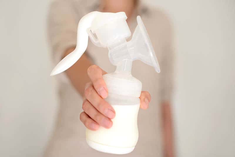 woman holding Manual Breast Pumps