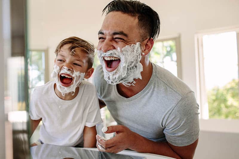 father and son shaving together