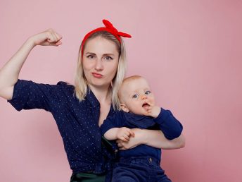 strong woman with baby in hands