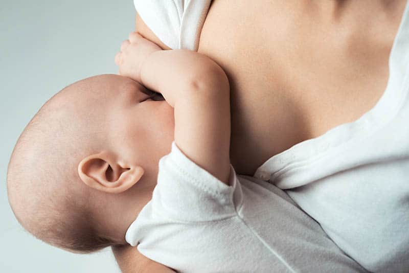 baby breastfeeding mother