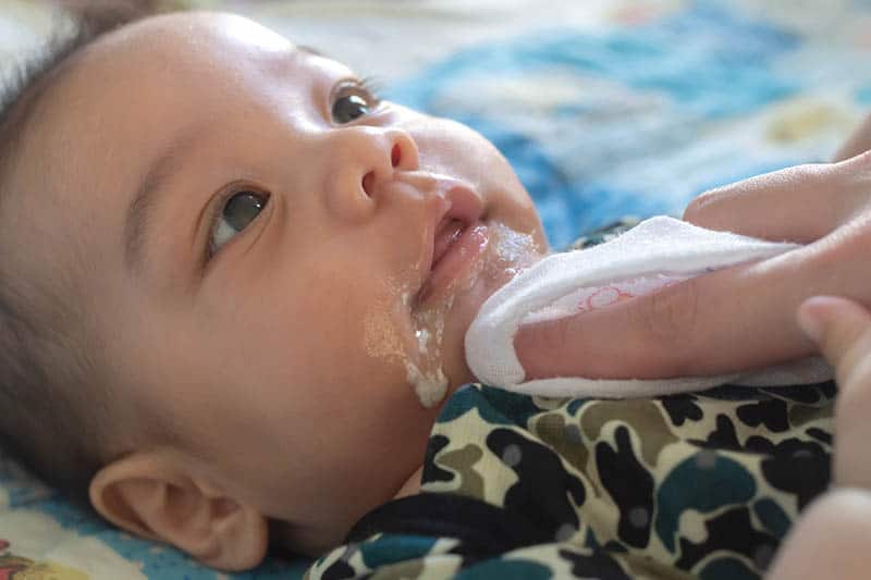 baby spitting because of oversupply of milk