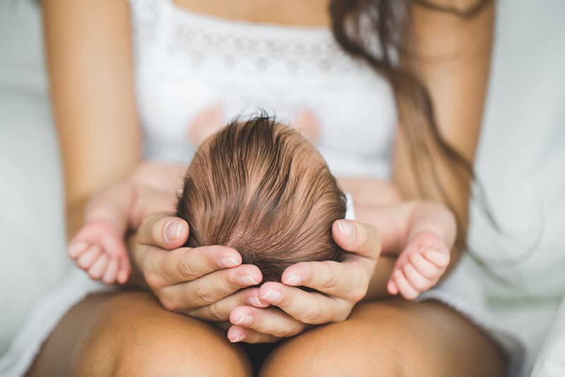 mother holding little baby