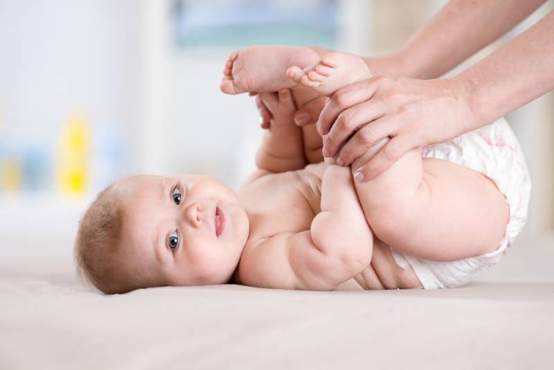 baby doing exercise with mom 