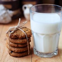 lactation cookies served with a glass of milk on the table