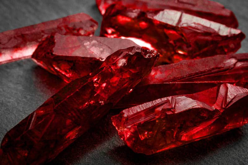 red ruby crystals on the black table