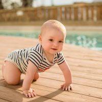cute baby crawling by the pool