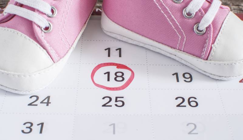 selected due date in calendar with pink baby shoes