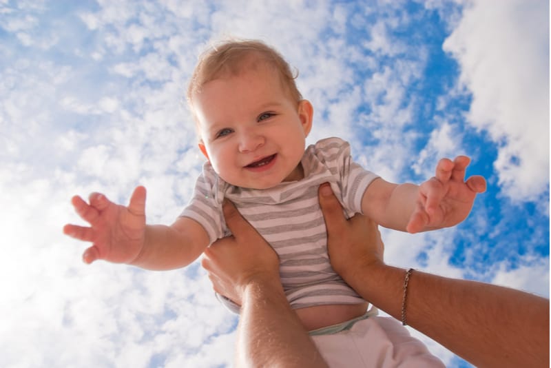 baby and sky in the background