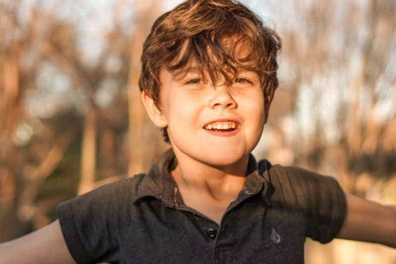 brunette boy smiling